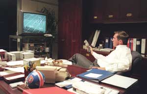 Shanahan studying game film late at night